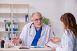 © Elnur - Old male doctor and his young female assistant in the clinic