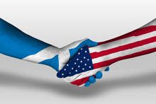 Handshake Between United States Of America And Scotland Flags Painted On Hands, Illustration With Clipping Path.