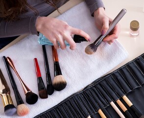 Wall Mural - Make-up artist preparing brushes for work