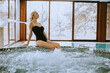 © BGStock72 - Young woman sitting and relaxing by the whirlpool bathtub