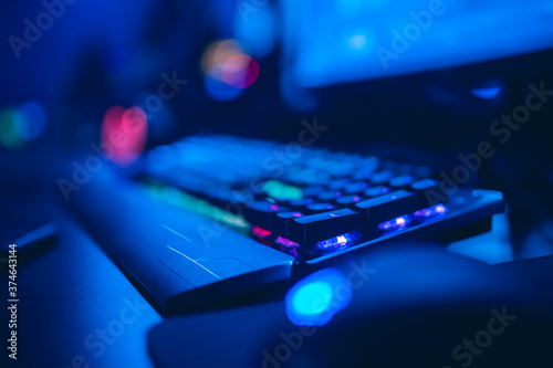 Fotografía Professional gamer playing online games tournaments pc computer with headphones,