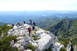 Fototapeta  - Silhouette of turists on trail in beautiful National Park Risnjak, Croatia