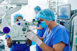 © DragonImages - Experienced surgeon performing laser eye vision correction in clinic