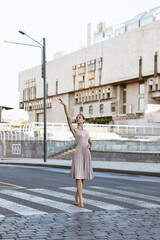 dancer in the background of the city at dawn.