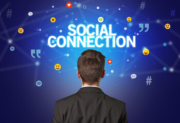 rear view of a businessman with social connection inscription, social networking concept
