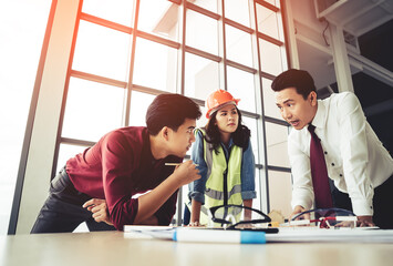 Wall Mural - Construction team with business man engineer and architect is brainstorming on working table with copy space on side