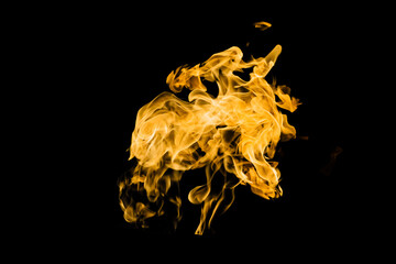 Fire flames on black background isolated. Burning gas or gasoline burns with fire and flames. Flaming burning sparks close-up, fire patterns. Infernal glow of fire in the dark with copy-space