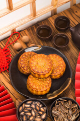 Poster - Mid-Autumn Festival concept, Traditional mooncakes on table  with teacup