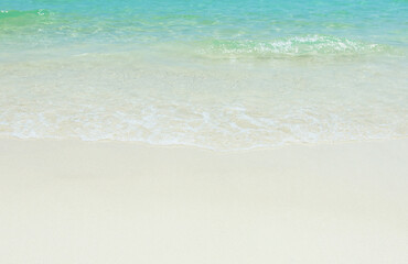 Wall Mural -  Blue sea ocean, water sun reflection, and sand background.