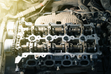 Wall Mural - cylinder head on a disassembled engine in a car workshop