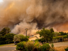 The California "River Fire" Of Salinas,  In Monterey County, Was Ignited By Dry Lightning On August 16, 2020, Fills The Sky With Dark Smoke And Flames As It Burns Close To A Houses On Its First Day.  