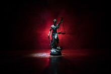 The Statue Of Justice - Lady Justice Or Iustitia / Justitia The Roman Goddess Of Justice On A Dark Fire Background