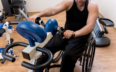 Disabled man training in the gym. Rehabilitation center