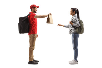 Wall Mural - Full length profile shot of a guy delivering a food to a female student