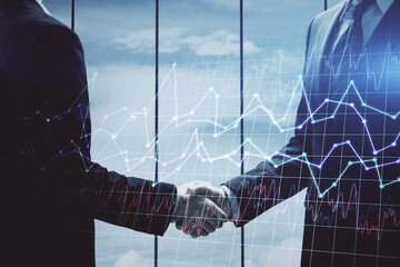 Double exposure of forex graph hologram and handshake of two men. Stock market concept.