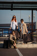 © teksomolika - Young women with shopping bags on a bus stop