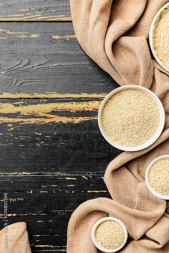 Bowls with healthy quinoa on table