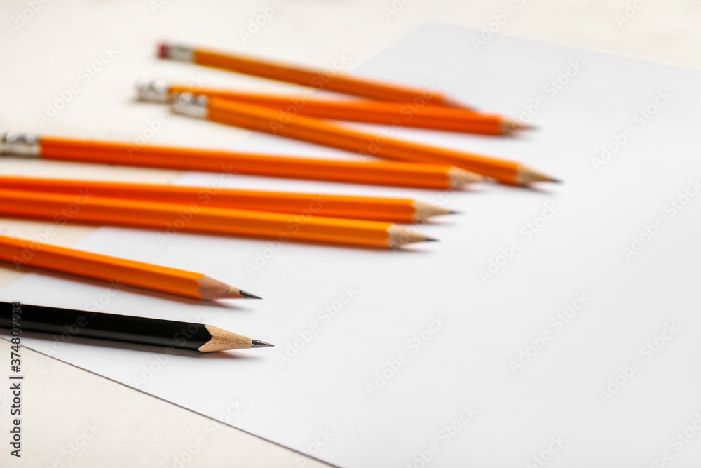 Different pencils on white background. Racism concept