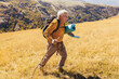 © Mediteraneo - Senior man on hike through beautiful countryside in autumn.