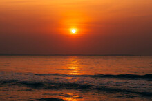 Sunrise On The Backdrop Of Orange Sea And Sky