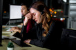 © Stella - Call center Asian woman staff with headphones working at call center service desk consultant getting upset because customers complain, work at night feeling sad, tired and exhausted, unhappy worker co