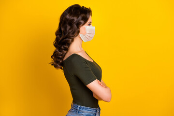 Poster - Profile side view portrait of her she attractive healthy wavy-haired girl folded arms wear safety mask stop contagious influenza pandemia isolated bright vivid shine vibrant yellow color background