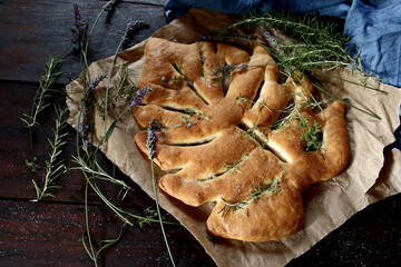 Fougasse, traditional french bread on wooden background