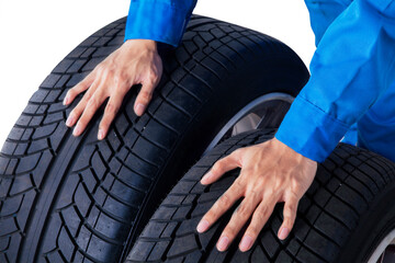 Mechanic hands pushing two car tires on studio