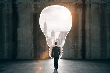 Aufkleber - Businessman in black interior with light bulb window and city view.