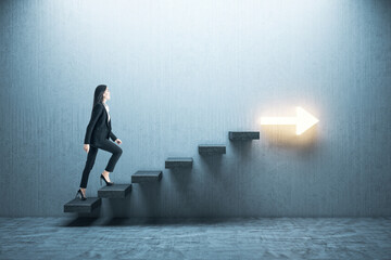 young businesswoman moving up on stairs with arrow