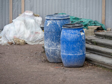 Plastic Blue Barrels On The Construction Site