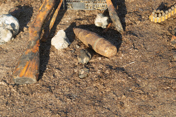 Wall Mural - World war 2 weapons and ammunition found at sea. Old rusty shotgun and ammunition, a mine. Relics from the great war.