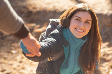 Sticker - Portrait of happy young woman outstretching hand to man