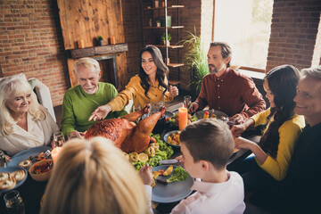 Wall Mural - Portrait of nice attractive cheerful family preteen small little brother sister meeting eating enjoying tasty yummy festal meal occasion spending weekend at modern loft brick industrial interior