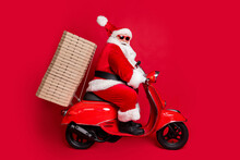 Full Length Profile Photo Of Retired Grandpa White Beard Ride Pizza Boxes Support Sponsoring Newyear Event Wear Santa X-mas Costume Coat Sunglass Cap Boots Isolated Red Color Background