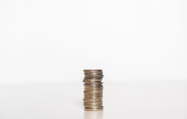 silver coin stack row growing pile on white background for money saving and investment business financial and banking concept.