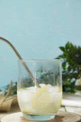 Canvas Print - Vertical shot of a glass of fresh cold lemonade on a table