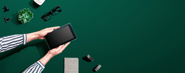 woman using a tablet computer from above