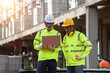 © EmmaStock - Supervisors and engineering use laptop at the construction site