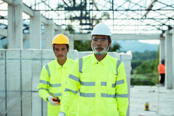 Canvas Print - engineering and construction with the worker in the construction site