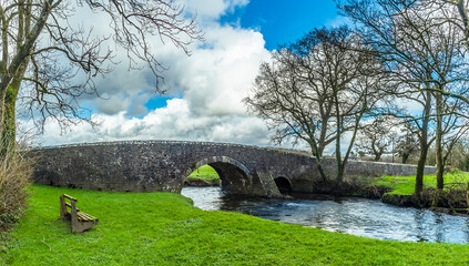 A panorama view of the Gelli bridge, an eighteenth-century, grade 2 listed bridge that spans the River Syfynwy, Wales