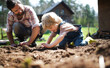 © Halfpoint - Father with small son working outdoors in garden, sustainable lifestyle concept.