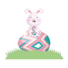 Canvas Print - cute easter little rabbit seated in egg painted grass scene