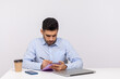 © khosrork - Busy inspired man employee writing creative idea paper notebook, preparing report doing paperwork, journalist taking notes in his office workplace. indoor studio shot isolated on white background