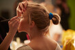 © B & J/Stocksy - Applying Makeup
