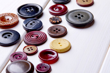 Poster - Background and texture of multicolored antique buttons