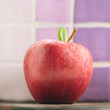 © HEX./Stocksy - Rip Red Apple with Green Leaf
