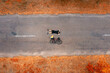 Top view of a cyclist with a road bike lying on the asphalt. Freedom and travel concept.
