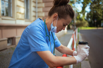 stressed modern medical practitioner woman outside near clinic