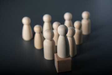 Wall Mural - Leadership concept, wooden human figure selective focus